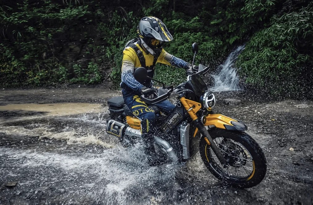 New AJS Leten LT190 riding through water. Credit: AJS Motorcycles.