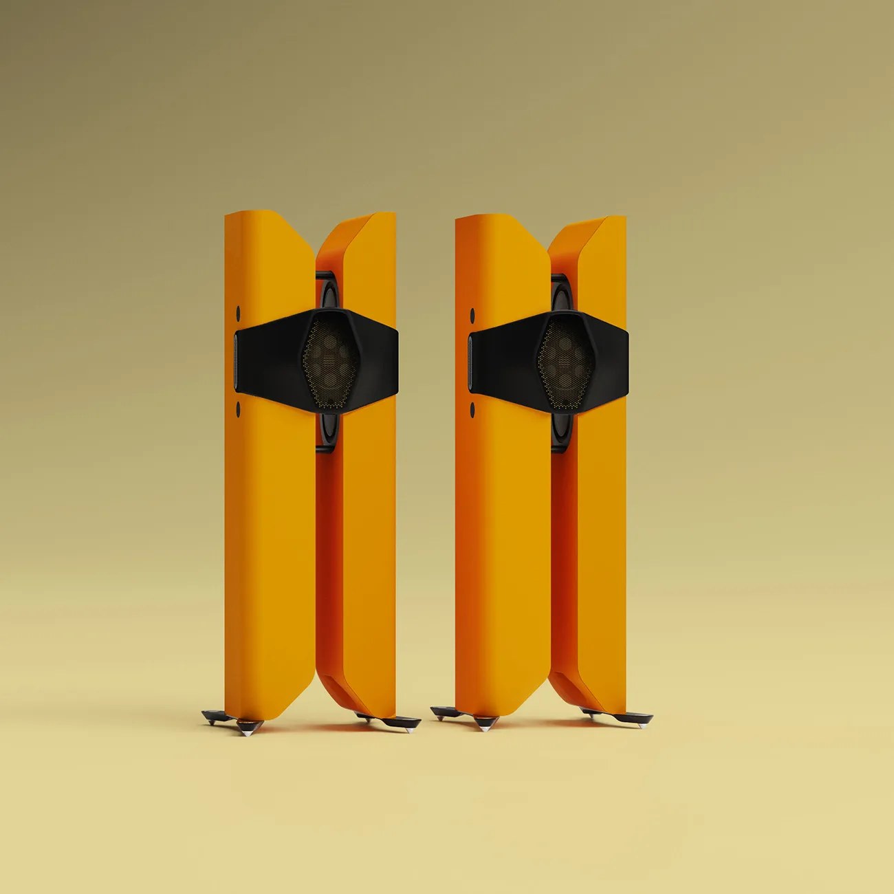 Pair of tall, orange floor-standing speakers with black central grille and pointed metal feet on a beige surface.